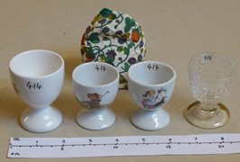 Collection of Egg Cups and One Egg Cosey